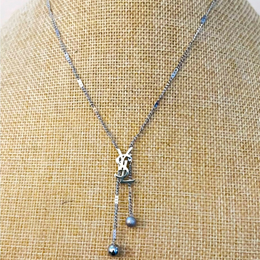 Unbranded necklace 18 carat silver plated “YSL” necklace.